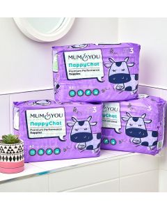 Three purple Mum & You nappies piled together, showcasing their vibrant color and softness in a neat stack.