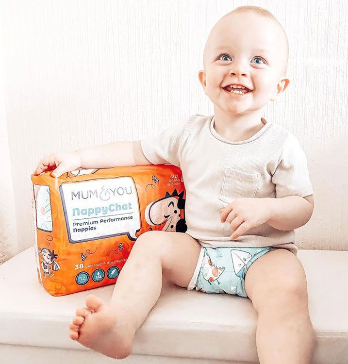 A baby on a bench with Mum & You Eco-nappies biodegradable, soft, and comfy! Perfect for bonding and fun conversations during changes.